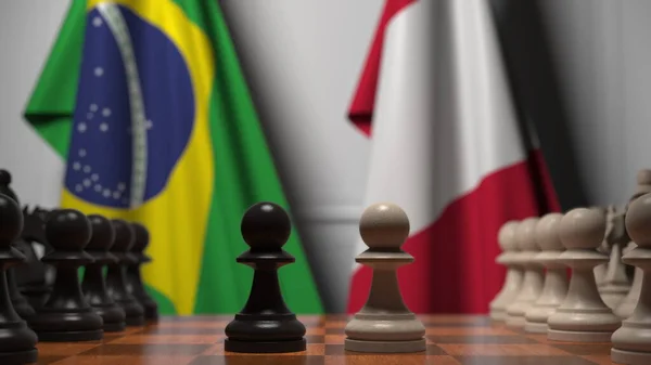 Flags of Brazil and Peru behind pawns on the chessboard. Chess game or political rivalry related 3D rendering — Stock Photo, Image