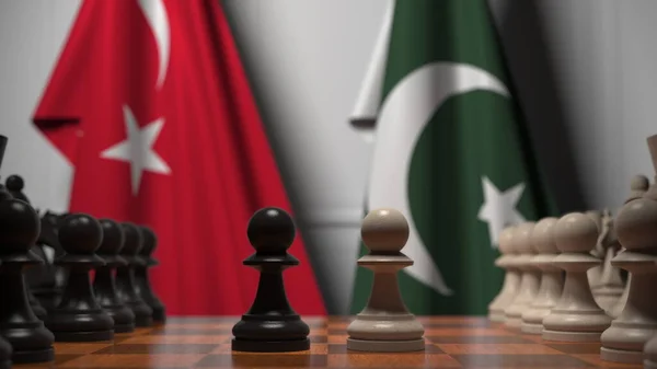 Banderas de Turquía y Pakistán detrás de peones en el tablero de ajedrez. Juego de ajedrez o rivalidad política relacionada con la representación 3D —  Fotos de Stock