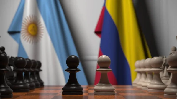 Banderas de Argentina y Colombia detrás de peones en el tablero de ajedrez. Juego de ajedrez o rivalidad política relacionada con la representación 3D — Foto de Stock