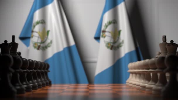 Chess game against flags of Guatemala. Political competition related 3D animation — Stock Video