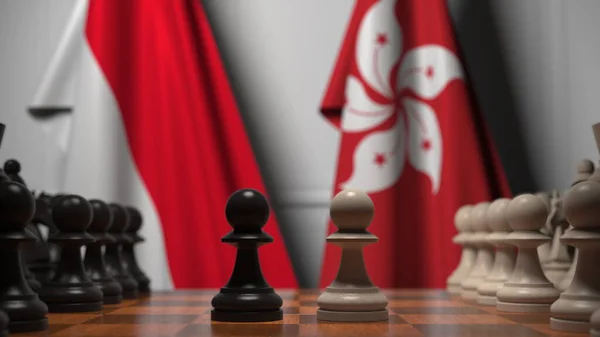 Indonézia és Hong Kong zászlói gyalogok mögött a sakktáblán. Sakk játék vagy politikai rivalizálás kapcsolódó 3d renderelés — Stock Fotó