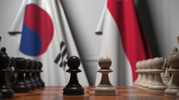 Dél-Korea és Szingapúr zászlói gyalogok mögött a sakktáblán. Sakk játék vagy politikai rivalizálás kapcsolódó 3d renderelés — Stock Fotó