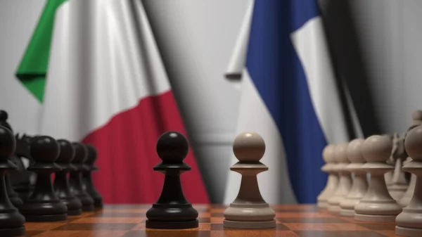 Bandeiras da Itália e Finlândia atrás de peões no tabuleiro de xadrez. Jogo de xadrez ou rivalidade política relacionada com a renderização 3D — Fotografia de Stock