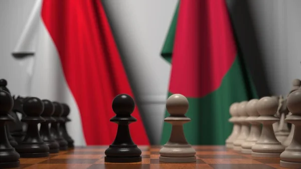 인도네시아와 방글라데시의 국기가 체스 판의 졸 뒤에 달려 있습니다. 체스 게임이나 정치적 라이벌은 3D 렌더링 과 관련 이 있다. — 스톡 사진