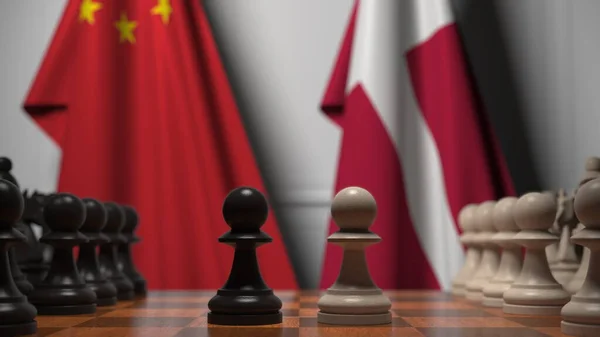 チェスボード上の質屋の後ろに中国とデンマークの旗。チェスゲームや政治的ライバル関係の3Dレンダリング — ストック写真