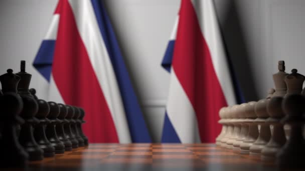 Schachspiel gegen Flaggen von Costa Rica. politische Konkurrenz im Zusammenhang mit 3D-Animation — Stockvideo