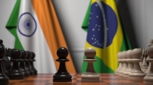 Шахматная игра против флагов Индии и Бразилии. Политическая конкуренция — стоковое фото