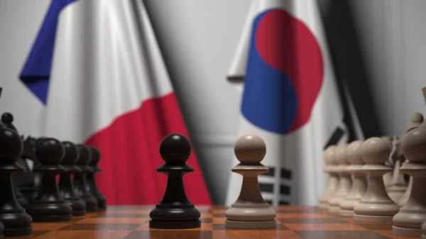 フランスと韓国の旗に対するチェスゲーム。政治競争関連の3Dレンダリング — ストック写真