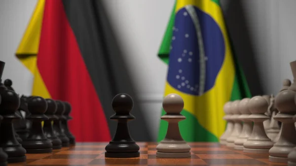 Jogo de xadrez contra bandeiras da Alemanha e do Brasil. Renderização 3D relacionada com a concorrência política — Fotografia de Stock