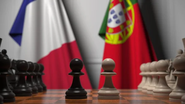 Bandiere di Francia e Portogallo dietro pedine sulla scacchiera. Rendering 3D relativo alla partita a scacchi o alla rivalità politica — Foto Stock