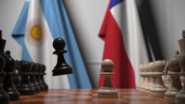 チェスボード上の質屋の後ろにアルゼンチンとチリの旗。チェスゲームや政治的ライバル関係の3Dレンダリング — ストック写真