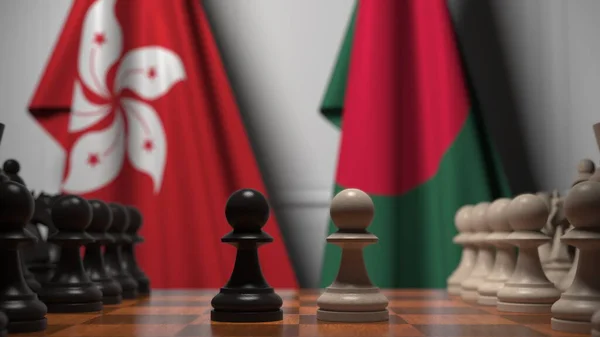 Hong Kong és Banglades zászlói gyalogok mögött a sakktáblán. Sakk játék vagy politikai rivalizálás kapcsolódó 3d renderelés — Stock Fotó