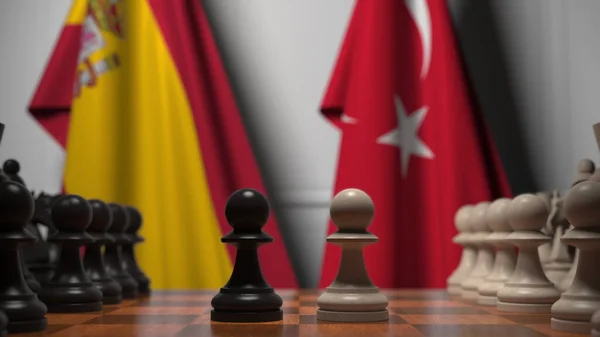 Sakk játék ellen zászlók Spanyolország és Törökország. Politikai versennyel kapcsolatos 3d tetemeltakarítás — Stock Fotó