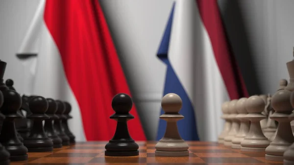 Шахматная игра против флагов Индонезии и Нидерландов. 3D рендеринг — стоковое фото