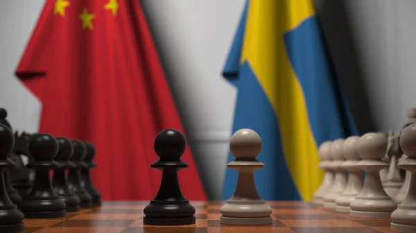 中国とスウェーデンの旗に対するチェスゲーム。政治競争関連の3Dレンダリング — ストック写真
