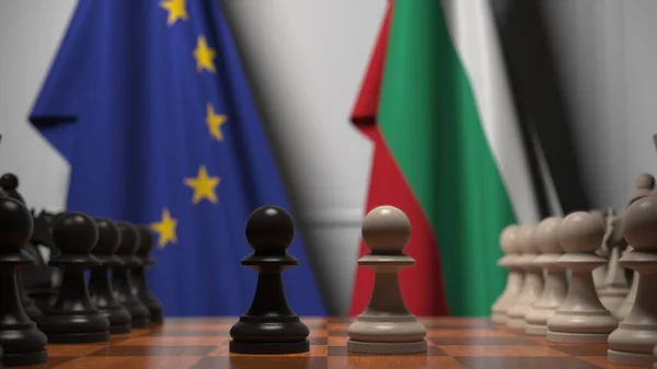 Bandiere dell'UE e della Bulgaria dietro pedine sulla scacchiera. Rendering 3D relativo alla partita a scacchi o alla rivalità politica — Foto Stock