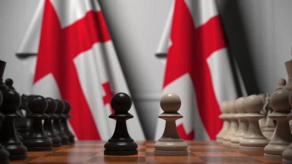 Шахматная игра против флагов Грузии. Политическая конкуренция — стоковое фото