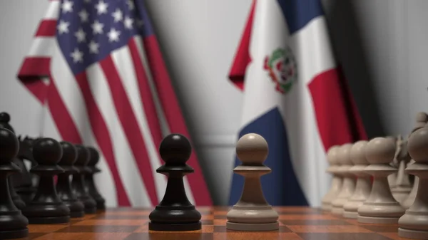 Прапори Уси і Домініканської Республіки за пішаками на шаховій дошці. Шахова гра або політичне суперництво пов'язують 3d рендеринг — стокове фото