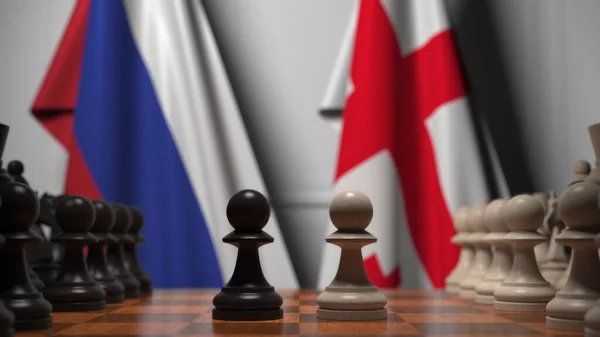 Rysslands och Georgiens flaggor bakom brickor på schackbrädet. Schackspel eller politisk rivalitet relaterad till 3D-rendering — Stockfoto