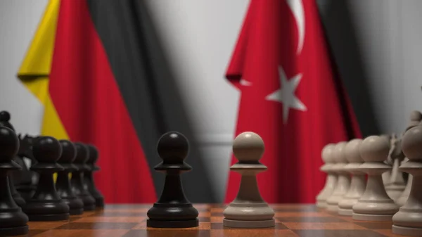 Almanya ve Türkiye bayraklarına karşı satranç oyunu. Siyasi rekabet 3D oluşturma — Stok fotoğraf