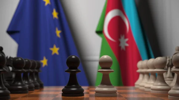 Drapeaux de l'UE et de l'Azerbaïdjan derrière des pions sur l'échiquier. Jeu d'échecs ou rivalité politique liée au rendu 3D — Photo