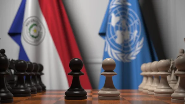 Σημαίες της Παραγουάης και των Ηνωμένων Εθνών πίσω από πιόνια στη σκακιέρα. Εννοιολογική σύνταξη 3d απόδοση — Φωτογραφία Αρχείου