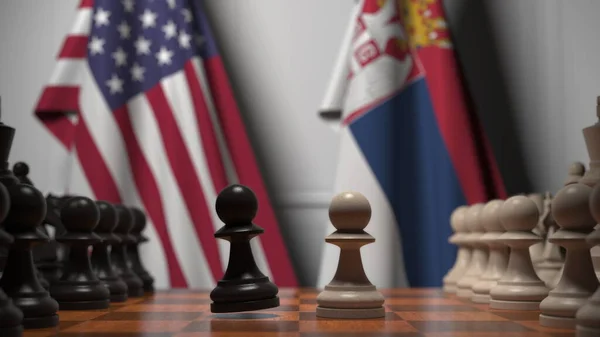 Flaggen der USA und Serbiens hinter Bauern auf dem Schachbrett. Schachspiel oder politische Rivalität im Zusammenhang mit 3D-Darstellung — Stockfoto