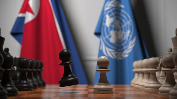 북한 과 유엔의 깃발 이 체스 판의 졸 뒤에 있다. 개념적 편집 3D 렌더링 — 스톡 사진