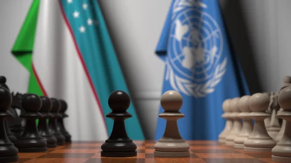우즈베키스탄 과 유엔의 국기가 체스 판의 기둥 뒤에 있다. 개념적 편집 3D 렌더링 — 스톡 사진