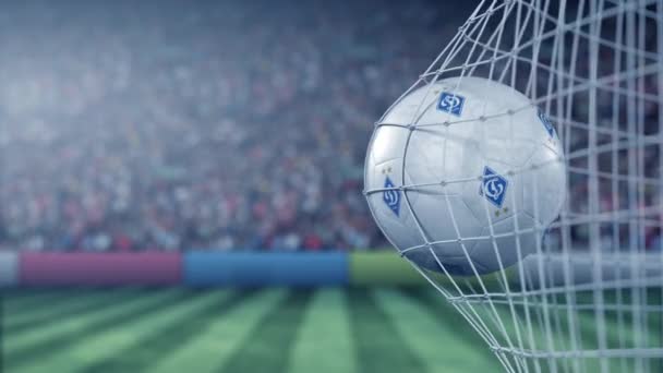 Ball with Dynamo Kyiv football club logo hits football goal net. Conceptual editorial 3D animation — ストック動画