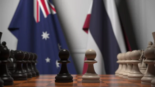 チェスボード上の質屋の後ろにオーストラリアとタイの旗。チェスゲームや政治的ライバル関係の3Dレンダリング — ストック写真