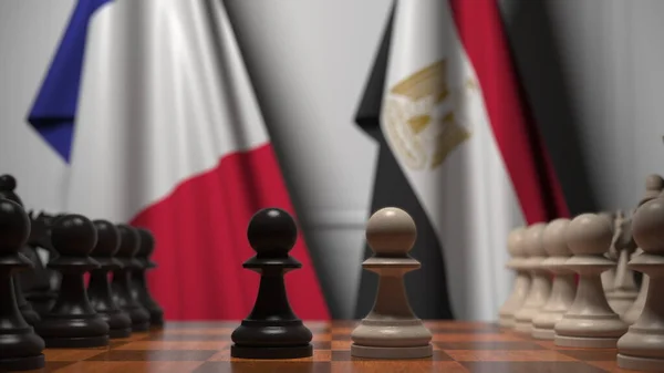 체스 판의 졸 뒤에 있는 프랑스와 이집트의 깃발이었습니다. 체스 게임이나 정치적 라이벌은 3D 렌더링 과 관련 이 있다. — 스톡 사진