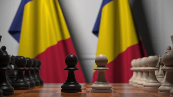 Прапори Румунії за пішаками на шаховій дошці. Шахова гра або політичне суперництво пов'язують 3d рендеринг — стокове фото