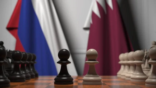 Флаги России и Катара за пешками на шахматной доске. Шахматная игра или политическое соперничество — стоковое фото