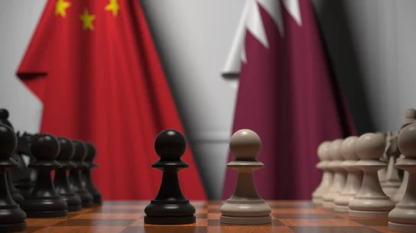중국 과 카타르의 국기가 체스 판의 졸 뒤에 있습니다. 체스 게임이나 정치적 라이벌은 3D 렌더링 과 관련 이 있다. — 스톡 사진