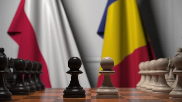 Прапори Польщі та Румунії за пішаками на шаховій дошці. Шахова гра або політичне суперництво пов'язують 3d рендеринг — стокове фото