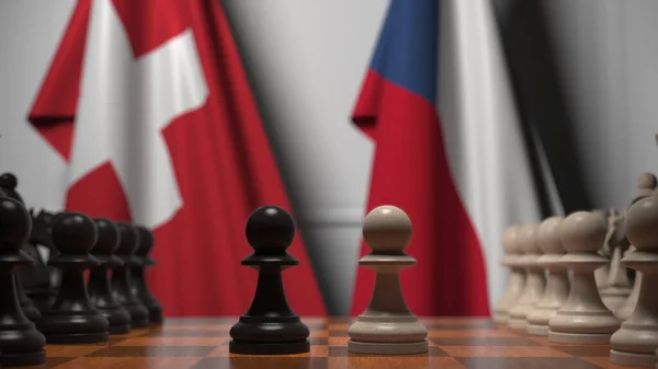 Drapeaux de la Suisse et de la République tchèque derrière des pions sur l'échiquier. Jeu d'échecs ou rivalité politique liée au rendu 3D — Photo