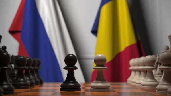 Flaggen Russlands und Rumäniens hinter Bauern auf dem Schachbrett. Schachspiel oder politische Rivalität im Zusammenhang mit 3D-Darstellung — Stockfoto