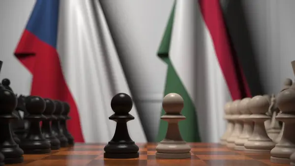 A Cseh Köztársaság és Magyarország zászlói gyalogok mögött a sakktáblán. Sakk játék vagy politikai rivalizálás kapcsolódó 3d renderelés — Stock Fotó