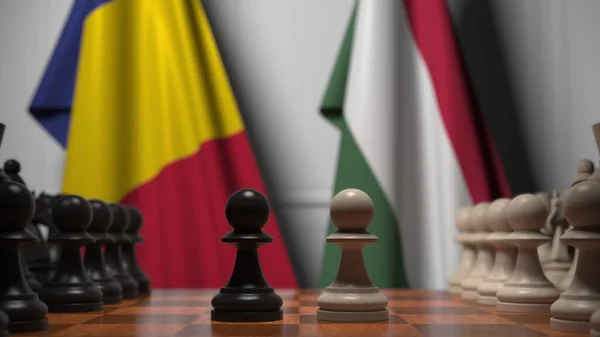 루마니아와 헝가리의 국기가 체스 판의 졸 뒤에 걸려 있다. 체스 게임이나 정치적 라이벌은 3D 렌더링 과 관련 이 있다. — 스톡 사진