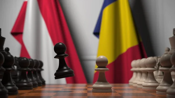Drapeaux de l'Autriche et de la Roumanie derrière pions sur l'échiquier. Jeu d'échecs ou rivalité politique liée au rendu 3D — Photo