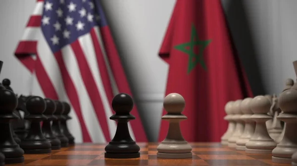 Amerikai és marokkói zászlók gyalogok mögött a sakktáblán. Sakk játék vagy politikai rivalizálás kapcsolódó 3d renderelés — Stock Fotó