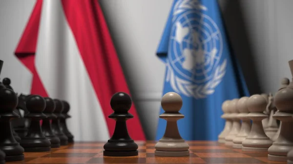 오스트리아와 국제 연합의 깃발 이 체스 판의 졸 뒤에 있었습니다. 체스 게임이나 정치적 라이벌은 3D 렌더링 과 관련 이 있다. — 스톡 사진