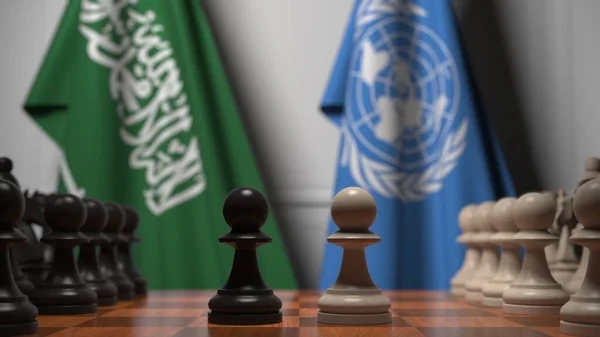 사우디 아라비아와 유엔의 깃발 이 체스 판의 졸 뒤에 있습니다. 체스 게임이나 정치적 라이벌은 3D 렌더링 과 관련 이 있다. — 스톡 사진