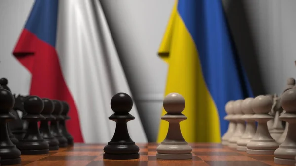 Drapeaux de la République tchèque et de l'Ukraine derrière des pions sur l'échiquier. Jeu d'échecs ou rivalité politique liée au rendu 3D — Photo