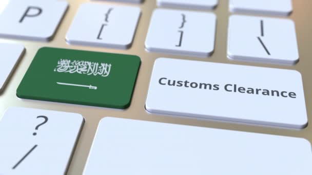 CUSTOMS CLEARANCE текст и флаг Саудовской Аравии на клавиатуре компьютера. Импорт или экспорт концептуальной 3D анимации — стоковое видео