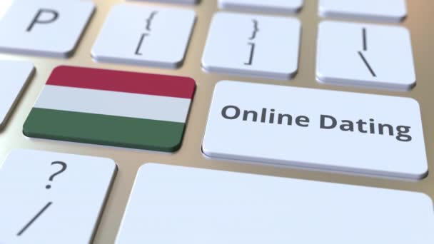 Online Dejting text och flagga Ungern på tangentbordet. Konceptuell 3D-animering — Stockvideo