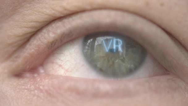 VR or Virtual Reality text on human eye. Technology related macro shot — Stock Video