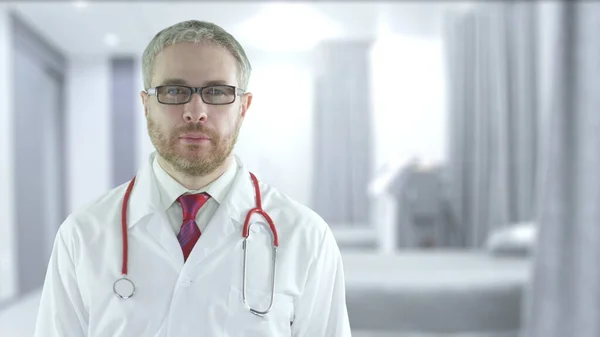 Focused doctor with red stethoscope in a modern hospital ward — Stock Photo, Image