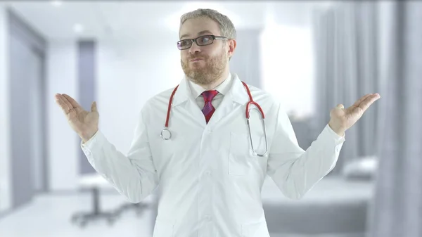 Incompetent doctor spreads his hands in a hospital ward — Stock Photo, Image